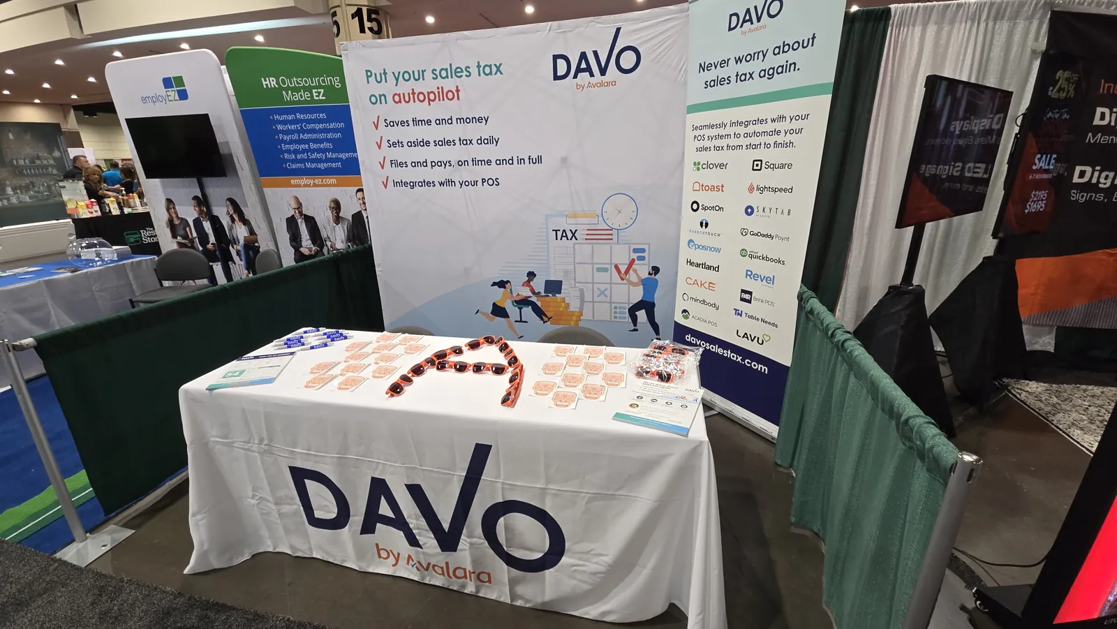 DAVO by Avalara trade show booth with a sales tax on autopilot banner